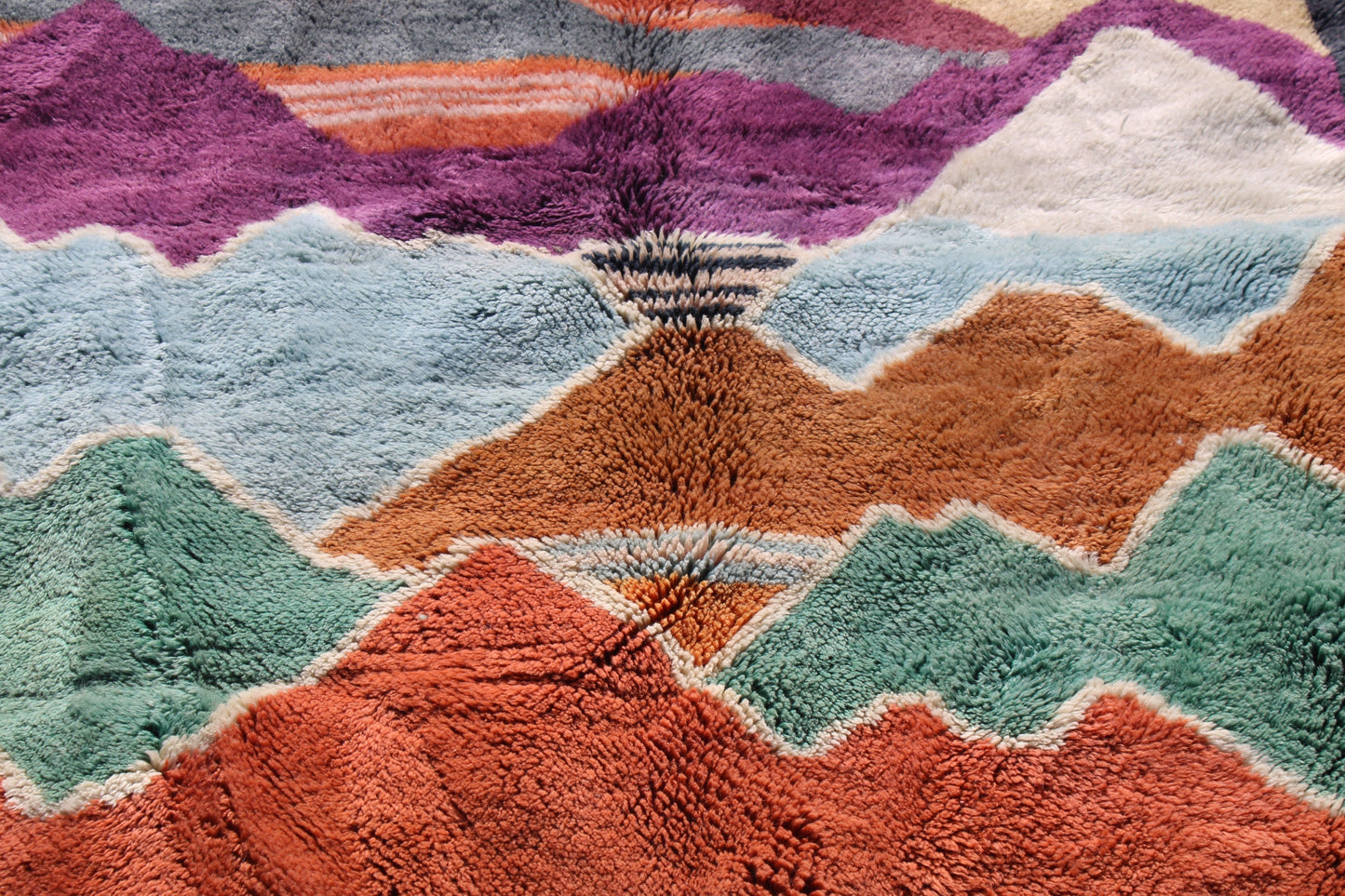Beni Ourain rugs originate from the Atlas Mountains of Morocco and are characterized by their distinctive, neutral-toned, and geometric designs. These handwoven rugs often feature a plush pile and are made by the Berber tribes, size is 270x192 cm