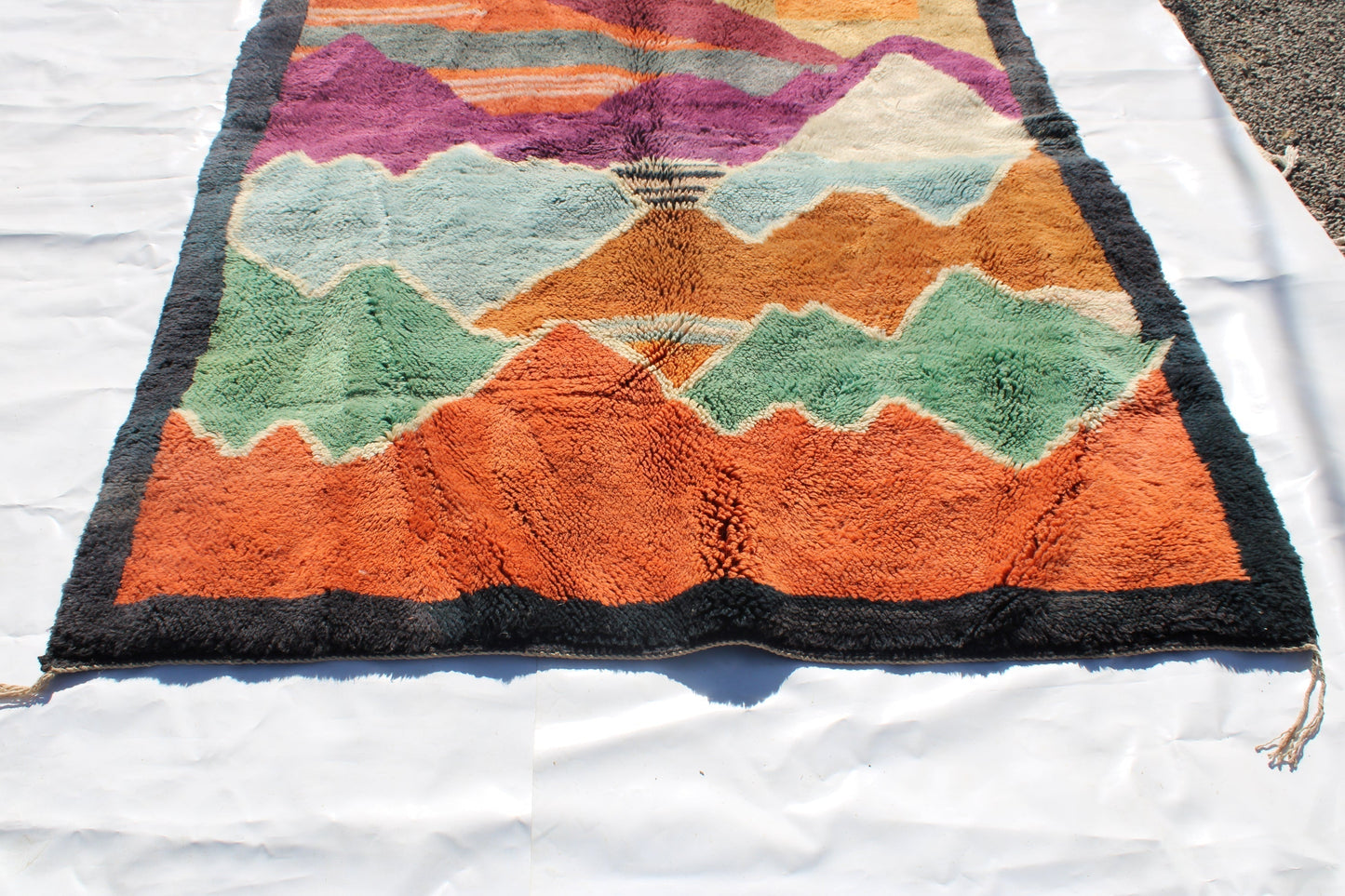 Beni Ourain rugs originate from the Atlas Mountains of Morocco and are characterized by their distinctive, neutral-toned, and geometric designs. These handwoven rugs often feature a plush pile and are made by the Berber tribes, size is 270x192 cm