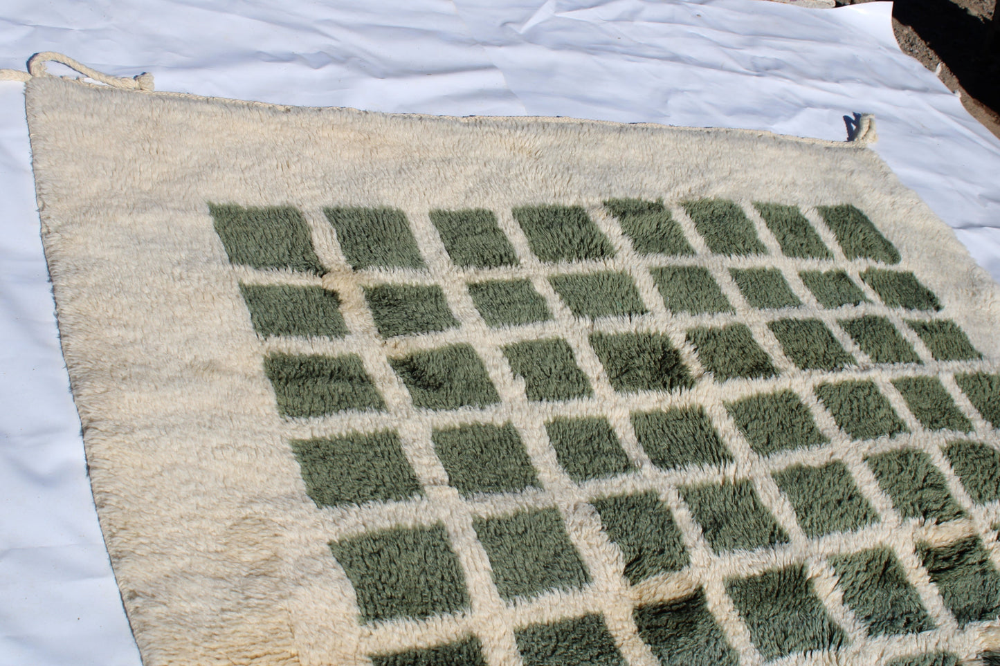 Beni Ourain rugs originate from the Atlas Mountains of Morocco and are characterized by their distinctive, neutral-toned, and geometric designs. These handwoven rugs often feature a plush pile and are made by the Berber tribes, size is 260x192 cm