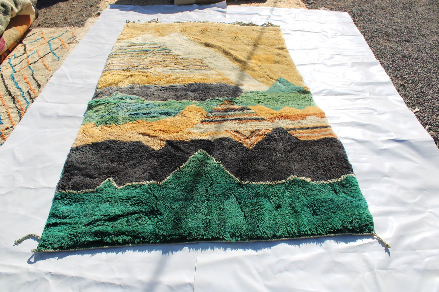 Beni Ourain rugs originate from the Atlas Mountains of Morocco and are characterized by their distinctive, neutral-toned, and geometric designs. These handwoven rugs often feature a plush pile and are made by the Berber tribes, size is 280x177 cm