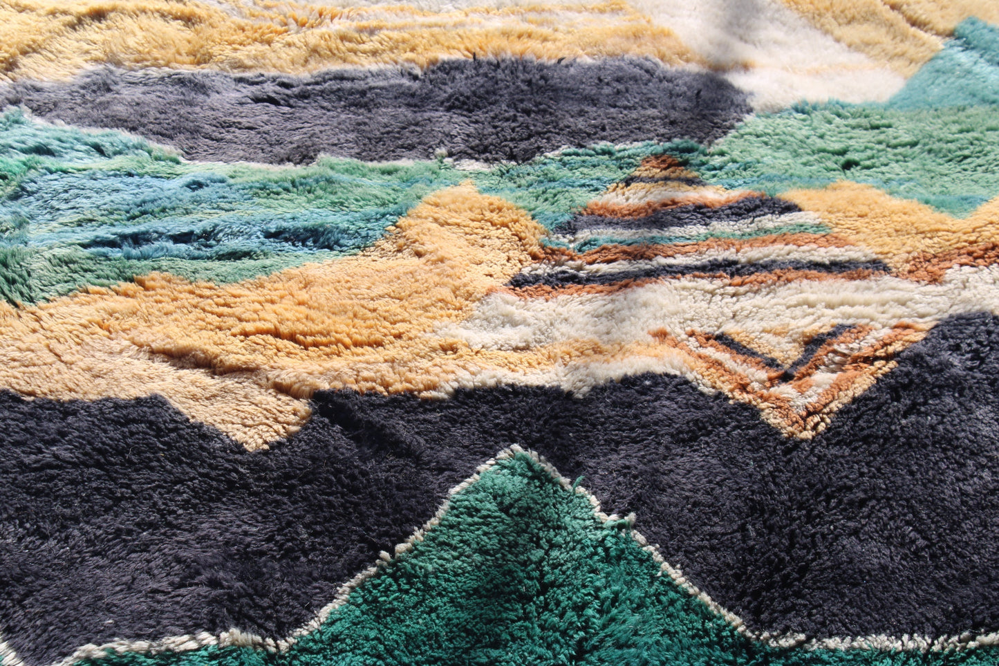 Beni Ourain rugs originate from the Atlas Mountains of Morocco and are characterized by their distinctive, neutral-toned, and geometric designs. These handwoven rugs often feature a plush pile and are made by the Berber tribes, size is 280x177 cm