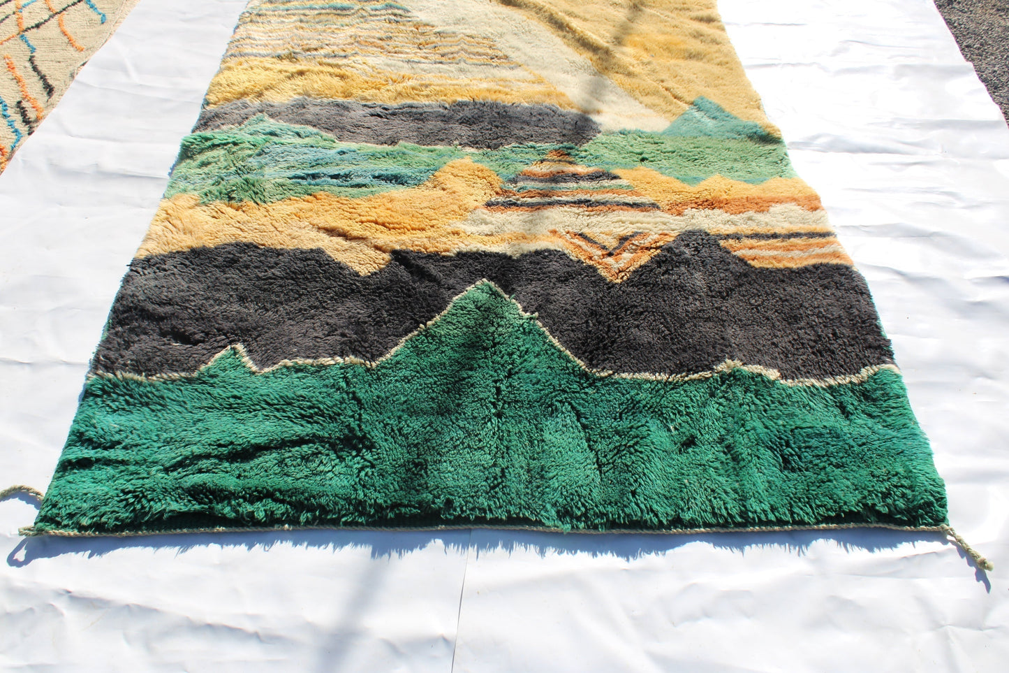 Beni Ourain rugs originate from the Atlas Mountains of Morocco and are characterized by their distinctive, neutral-toned, and geometric designs. These handwoven rugs often feature a plush pile and are made by the Berber tribes, size is 280x177 cm