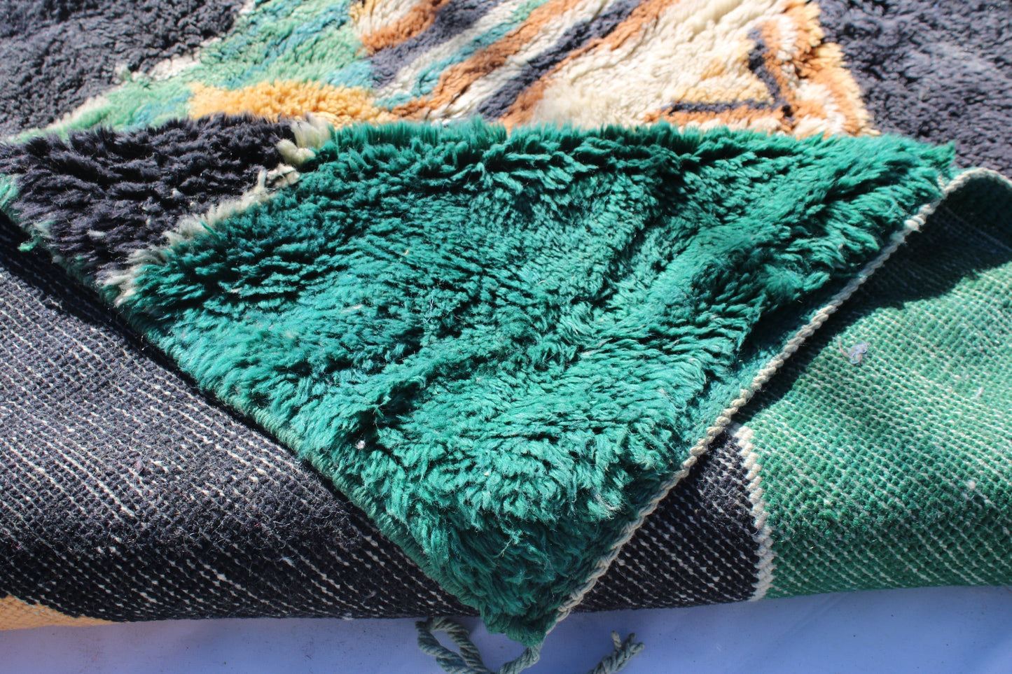 Beni Ourain rugs originate from the Atlas Mountains of Morocco and are characterized by their distinctive, neutral-toned, and geometric designs. These handwoven rugs often feature a plush pile and are made by the Berber tribes, size is 280x177 cm