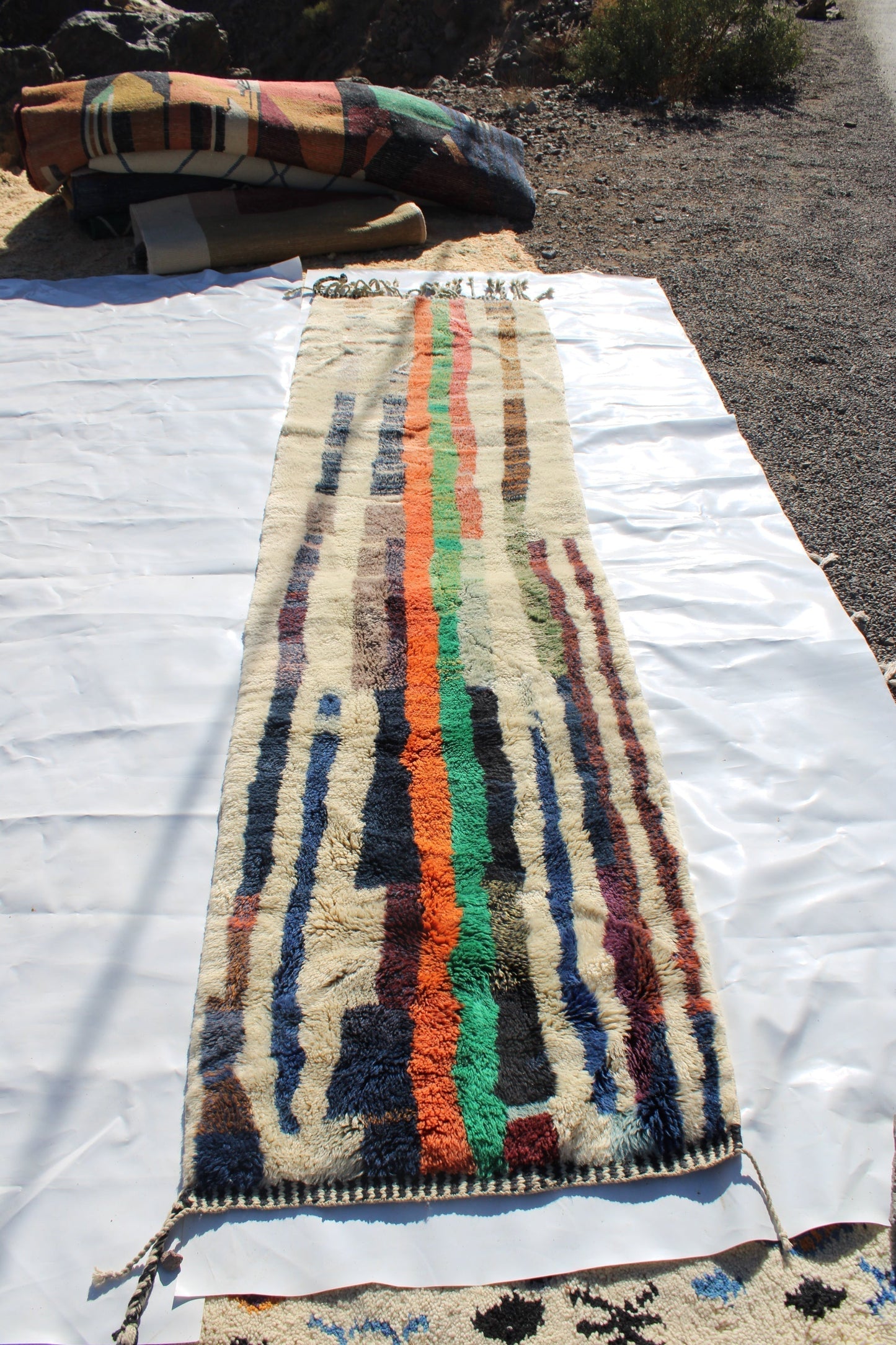Beni Ourain rugs originate from the Atlas Mountains of Morocco and are characterized by their distinctive, neutral-toned, and geometric designs. These handwoven rugs often feature a plush pile and are made by the Berber tribes, size is 365x92 cm