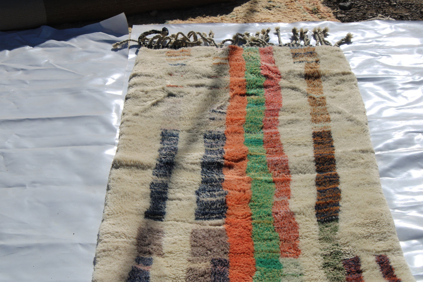 Beni Ourain rugs originate from the Atlas Mountains of Morocco and are characterized by their distinctive, neutral-toned, and geometric designs. These handwoven rugs often feature a plush pile and are made by the Berber tribes, size is 365x92 cm