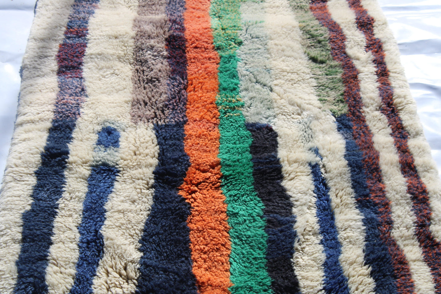 Beni Ourain rugs originate from the Atlas Mountains of Morocco and are characterized by their distinctive, neutral-toned, and geometric designs. These handwoven rugs often feature a plush pile and are made by the Berber tribes, size is 365x92 cm