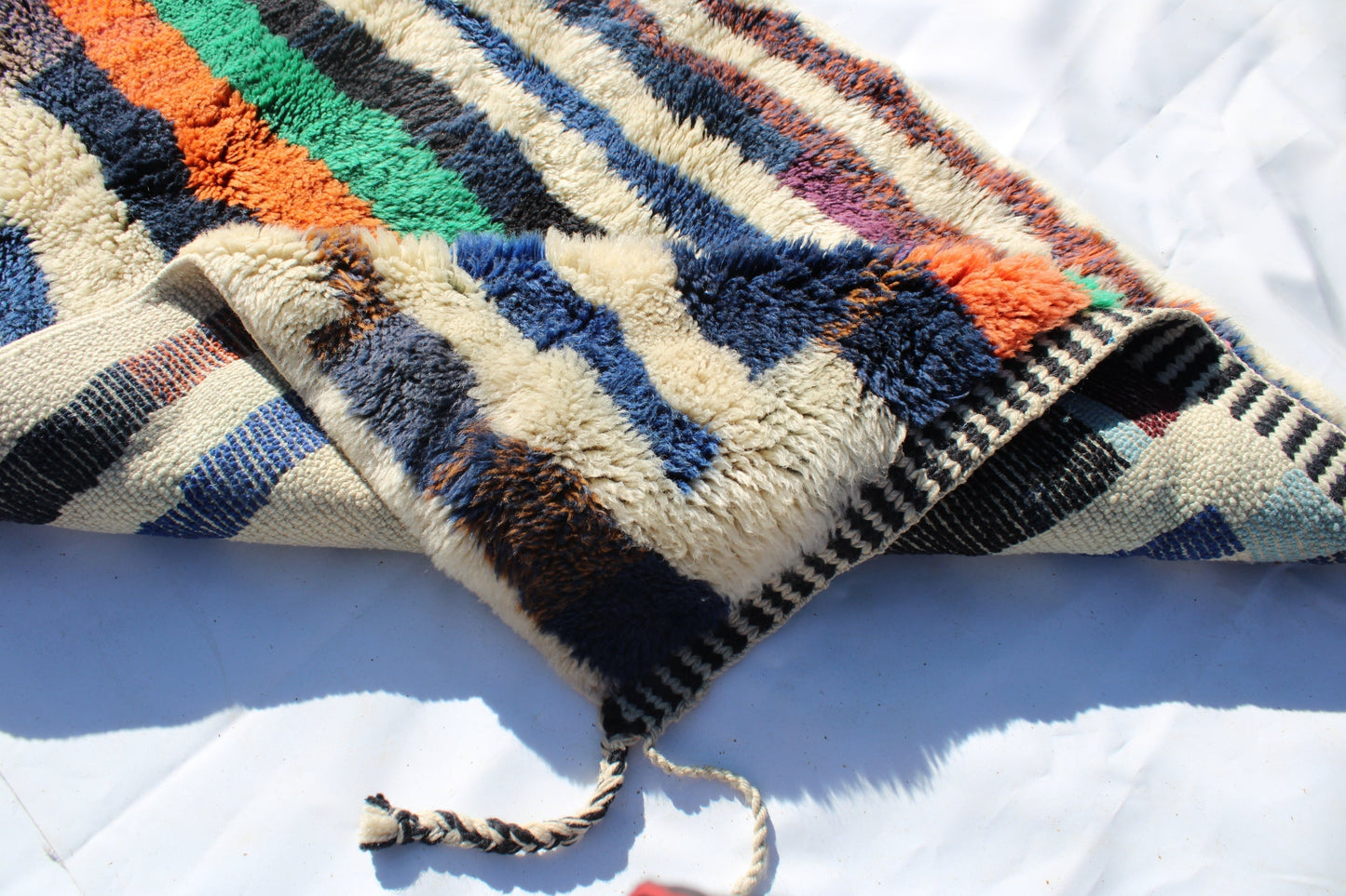 Beni Ourain rugs originate from the Atlas Mountains of Morocco and are characterized by their distinctive, neutral-toned, and geometric designs. These handwoven rugs often feature a plush pile and are made by the Berber tribes, size is 365x92 cm