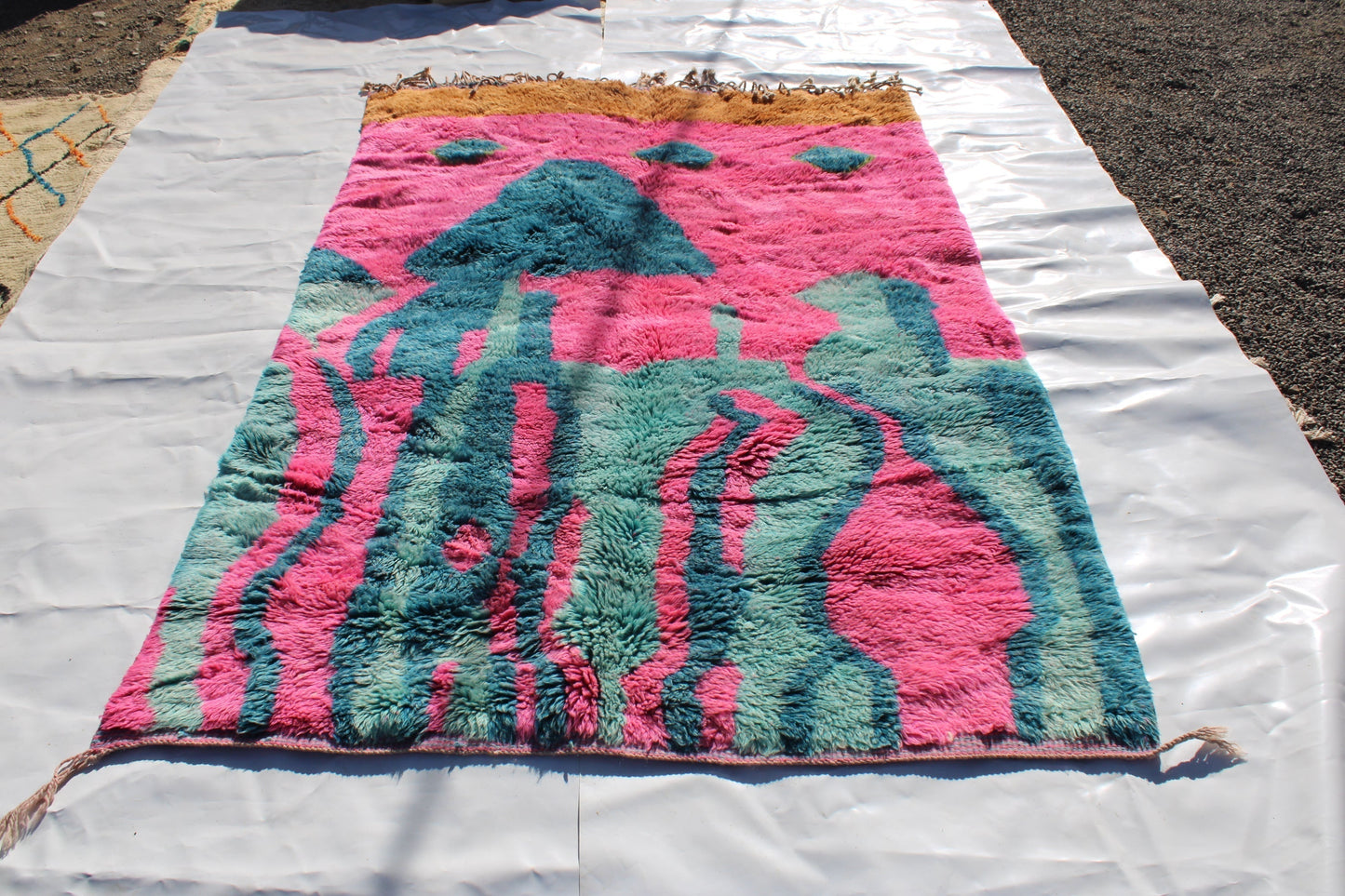 Beni Ourain rugs originate from the Atlas Mountains of Morocco and are characterized by their distinctive, neutral-toned, and geometric designs. These handwoven rugs often feature a plush pile and are made by the Berber tribes, size is 263x177 cm
