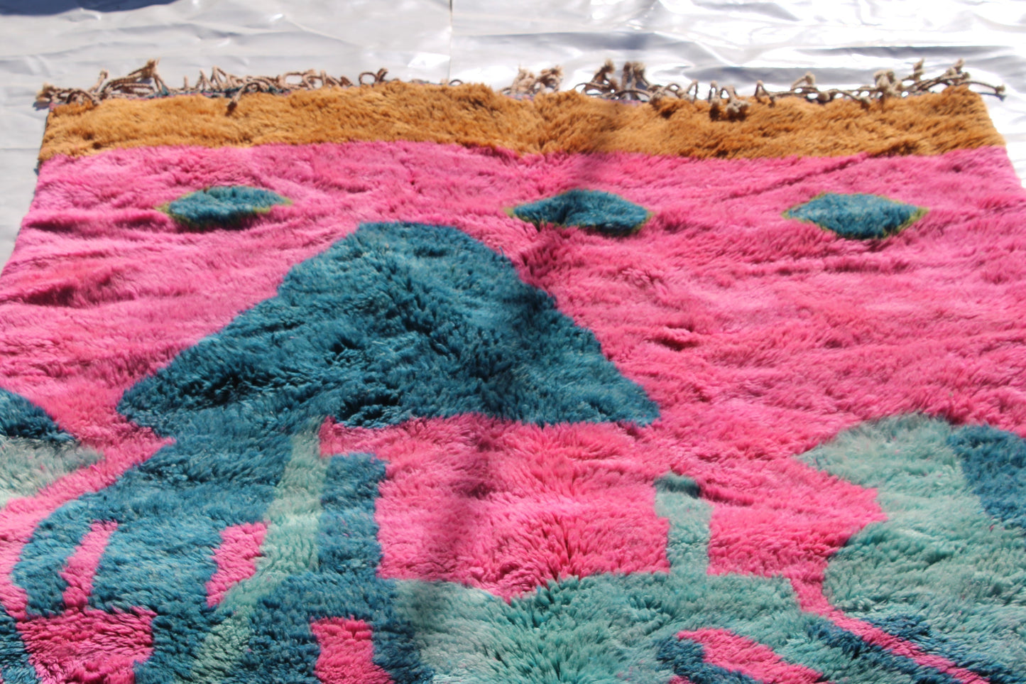Beni Ourain rugs originate from the Atlas Mountains of Morocco and are characterized by their distinctive, neutral-toned, and geometric designs. These handwoven rugs often feature a plush pile and are made by the Berber tribes, size is 263x177 cm