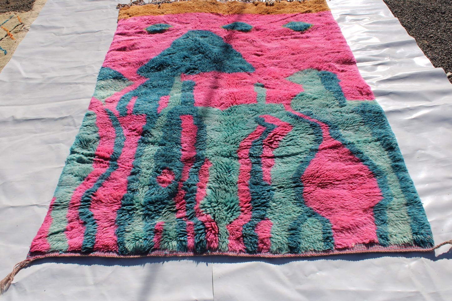 Beni Ourain rugs originate from the Atlas Mountains of Morocco and are characterized by their distinctive, neutral-toned, and geometric designs. These handwoven rugs often feature a plush pile and are made by the Berber tribes, size is 263x177 cm