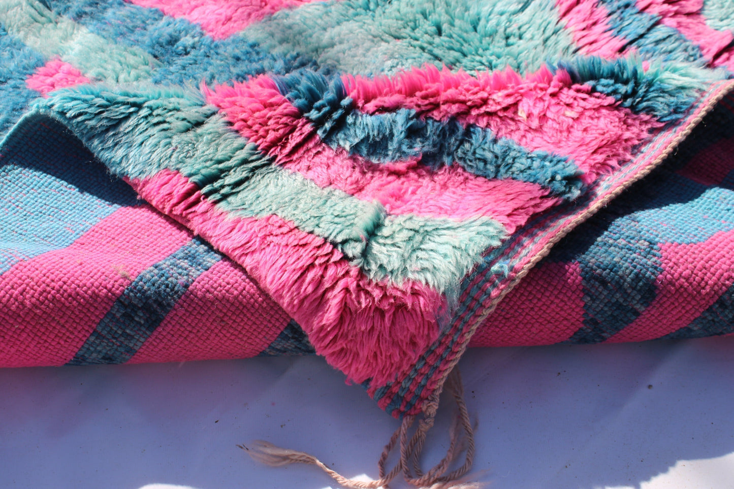 Beni Ourain rugs originate from the Atlas Mountains of Morocco and are characterized by their distinctive, neutral-toned, and geometric designs. These handwoven rugs often feature a plush pile and are made by the Berber tribes, size is 263x177 cm