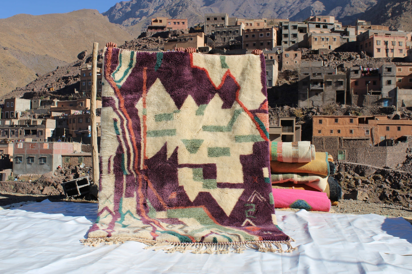 Beni Ourain rugs originate from the Atlas Mountains of Morocco and are characterized by their distinctive, neutral-toned, and geometric designs. These handwoven rugs often feature a plush pile and are made by the Berber tribes, size is 224x160 cm