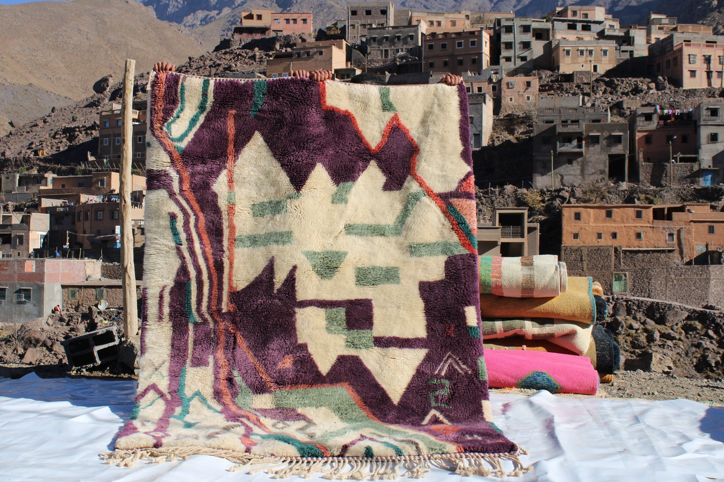 Beni Ourain rugs originate from the Atlas Mountains of Morocco and are characterized by their distinctive, neutral-toned, and geometric designs. These handwoven rugs often feature a plush pile and are made by the Berber tribes, size is 224x160 cm