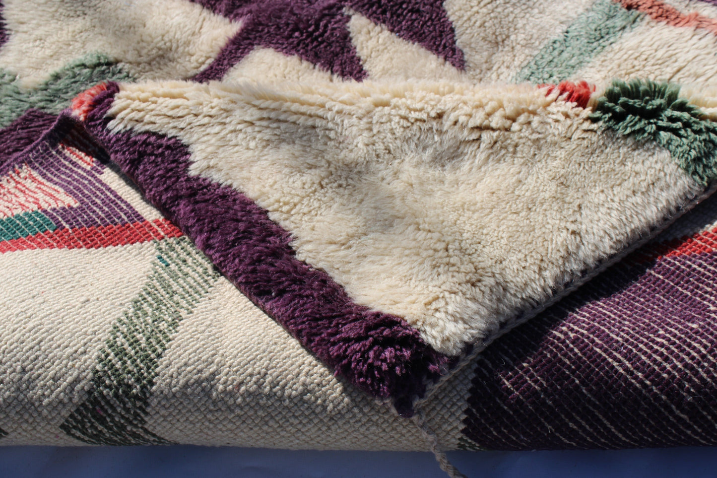 Beni Ourain rugs originate from the Atlas Mountains of Morocco and are characterized by their distinctive, neutral-toned, and geometric designs. These handwoven rugs often feature a plush pile and are made by the Berber tribes, size is 224x160 cm