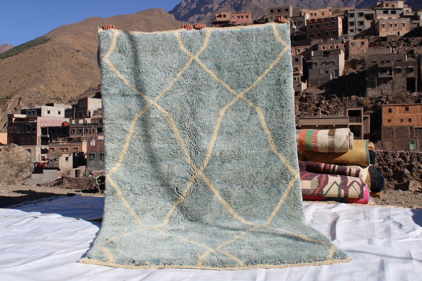 Beni Ourain rugs originate from the Atlas Mountains of Morocco and are characterized by their distinctive, neutral-toned, and geometric designs. These handwoven rugs often feature a plush pile and are made by the Berber tribes, size is 260x160 cm