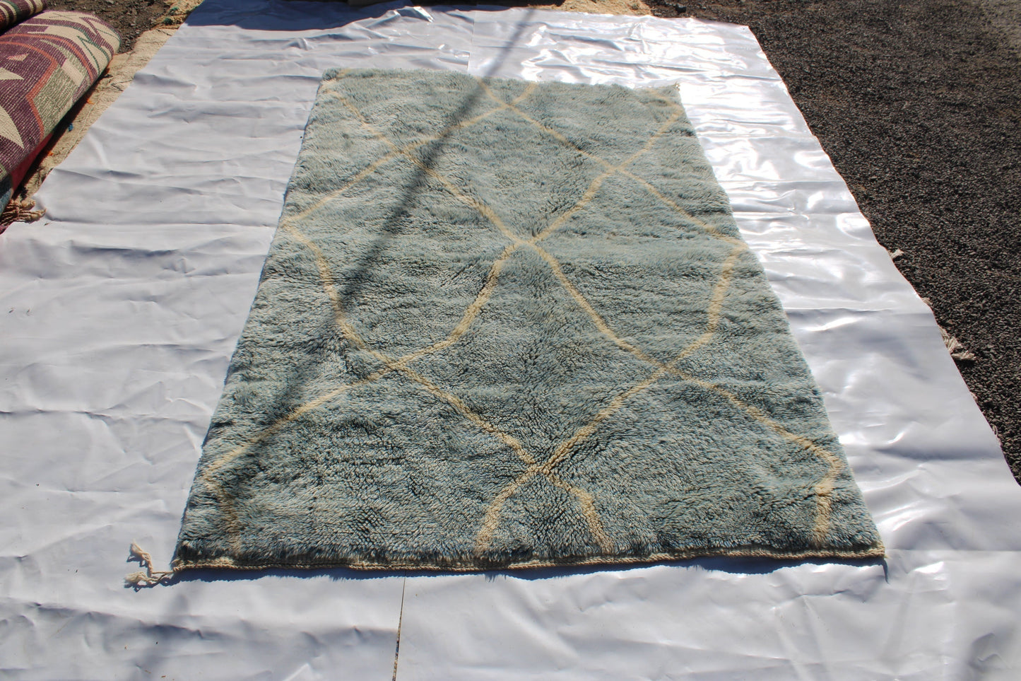 Beni Ourain rugs originate from the Atlas Mountains of Morocco and are characterized by their distinctive, neutral-toned, and geometric designs. These handwoven rugs often feature a plush pile and are made by the Berber tribes, size is 260x160 cm