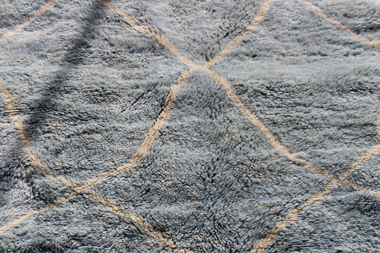 Beni Ourain rugs originate from the Atlas Mountains of Morocco and are characterized by their distinctive, neutral-toned, and geometric designs. These handwoven rugs often feature a plush pile and are made by the Berber tribes, size is 260x160 cm