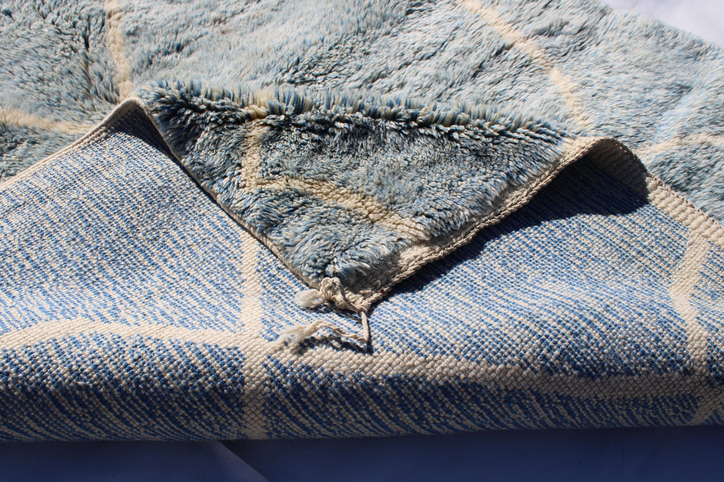 Beni Ourain rugs originate from the Atlas Mountains of Morocco and are characterized by their distinctive, neutral-toned, and geometric designs. These handwoven rugs often feature a plush pile and are made by the Berber tribes, size is 260x160 cm