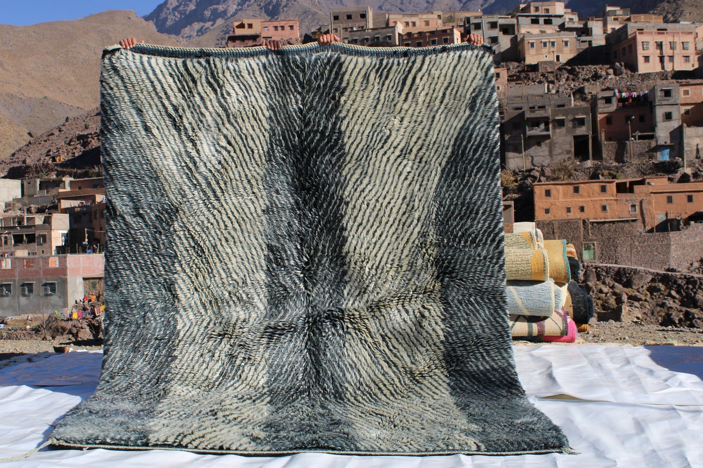 Beni Ourain rugs originate from the Atlas Mountains of Morocco and are characterized by their distinctive, neutral-toned, and geometric designs. These handwoven rugs often feature a plush pile and are made by the Berber tribes, size is 254x190 cm