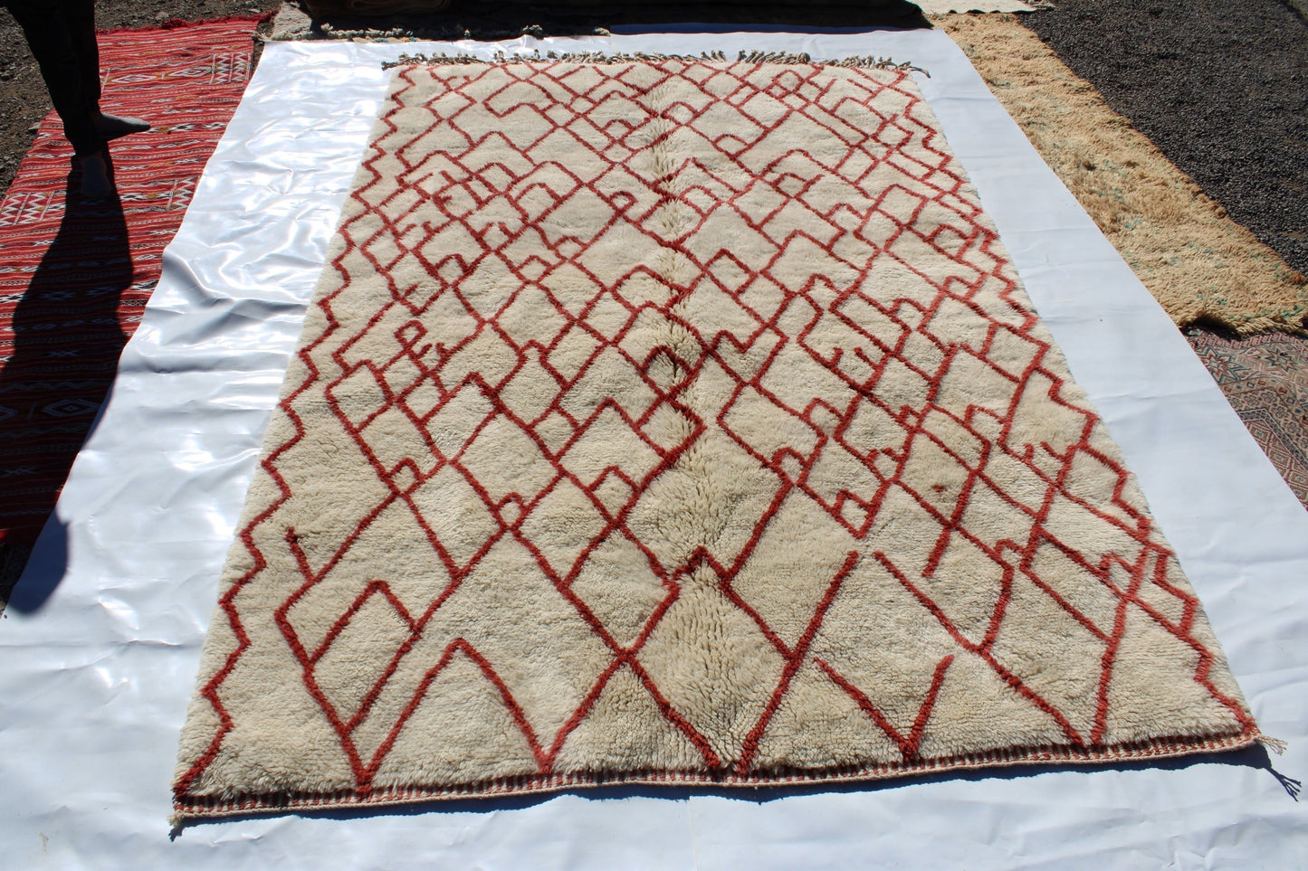 Beni Ourain rugs originate from the Atlas Mountains of Morocco and are characterized by their distinctive, neutral-toned, and geometric designs. These handwoven rugs often feature a plush pile and are made by the Berber tribes, size is 280x177 cm