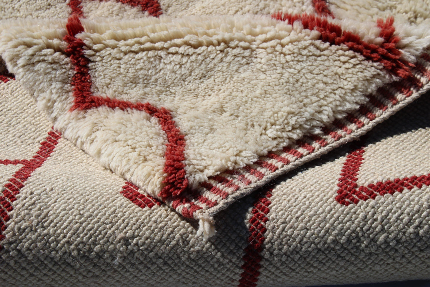 Beni Ourain rugs originate from the Atlas Mountains of Morocco and are characterized by their distinctive, neutral-toned, and geometric designs. These handwoven rugs often feature a plush pile and are made by the Berber tribes, size is 280x177 cm