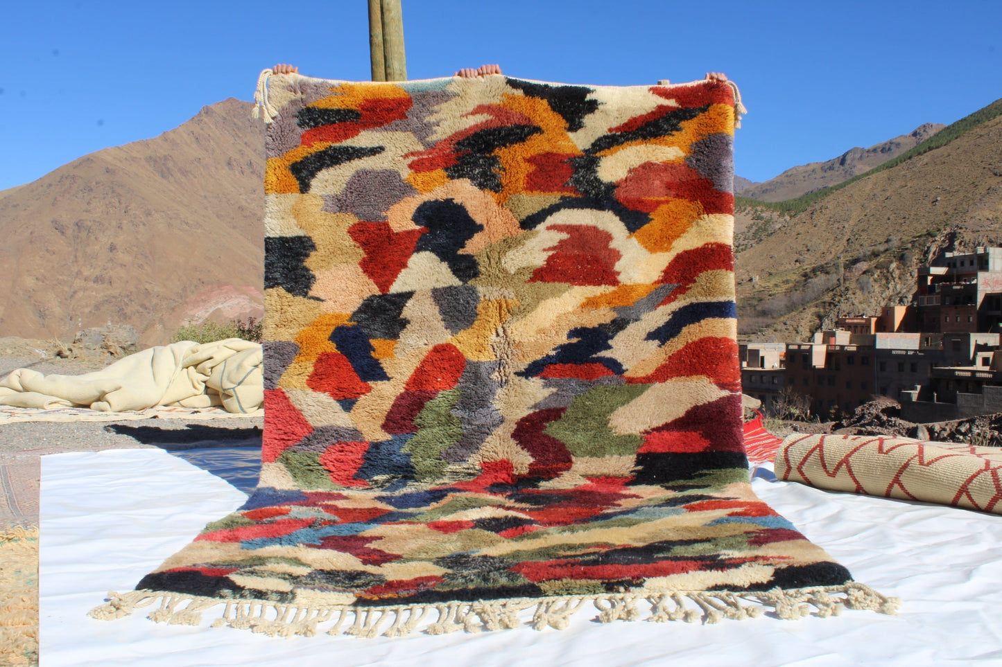 Beni Ourain rugs originate from the Atlas Mountains of Morocco and are characterized by their distinctive, neutral-toned, and geometric designs. These handwoven rugs often feature a plush pile and are made by the Berber tribes, size is 280x177 cm