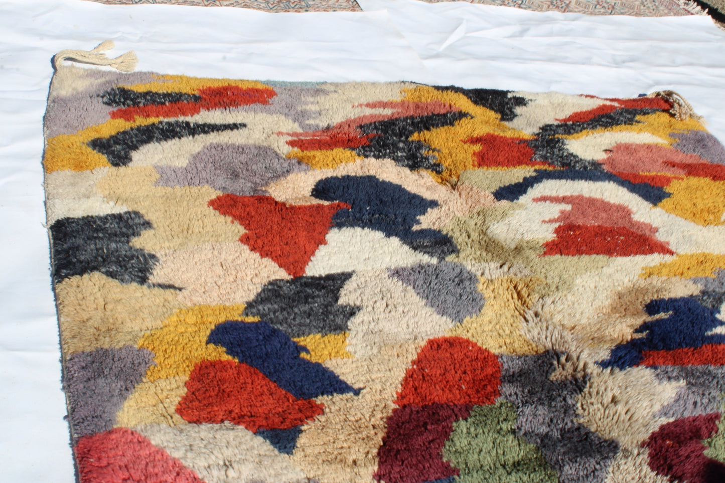 Beni Ourain rugs originate from the Atlas Mountains of Morocco and are characterized by their distinctive, neutral-toned, and geometric designs. These handwoven rugs often feature a plush pile and are made by the Berber tribes, size is 280x177 cm