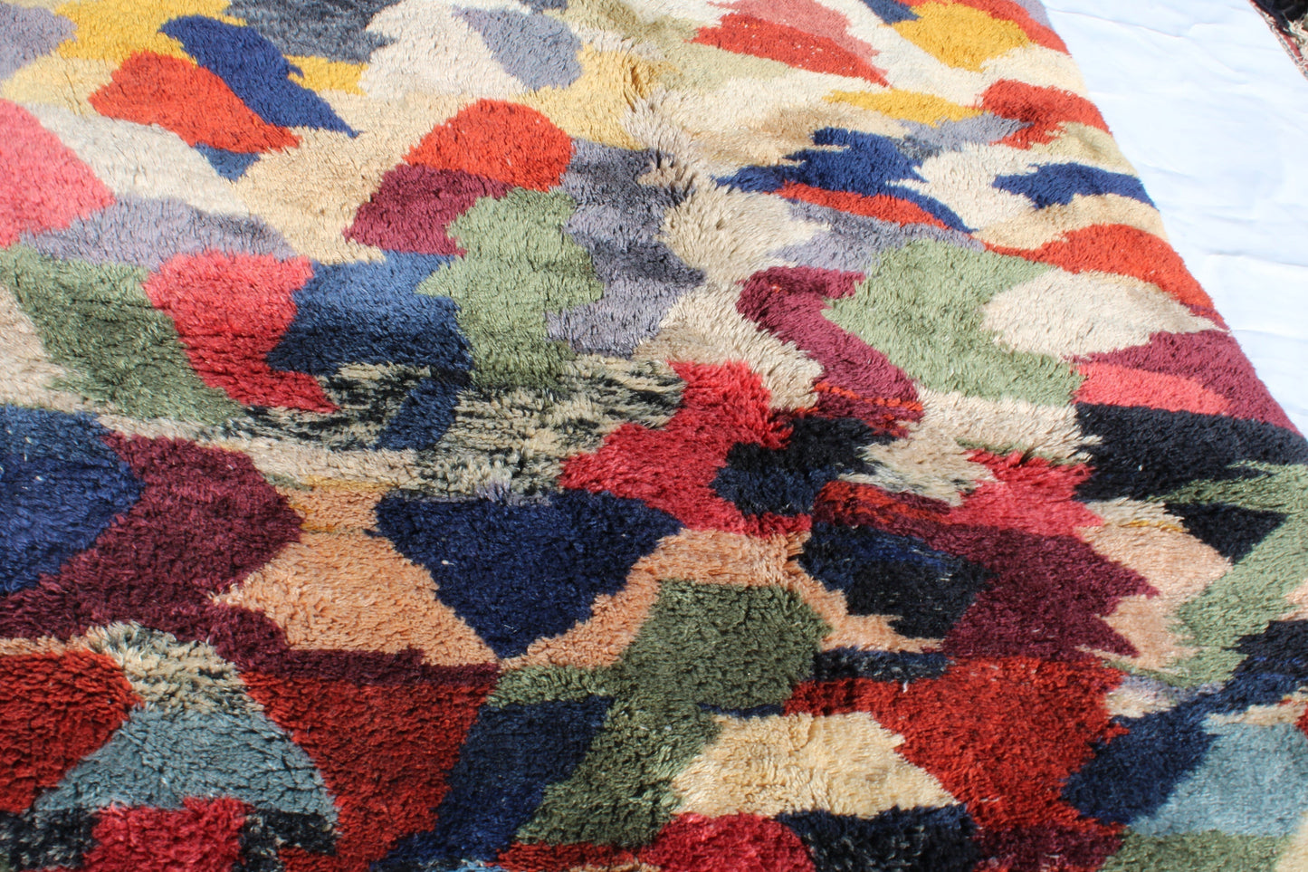 Beni Ourain rugs originate from the Atlas Mountains of Morocco and are characterized by their distinctive, neutral-toned, and geometric designs. These handwoven rugs often feature a plush pile and are made by the Berber tribes, size is 280x177 cm