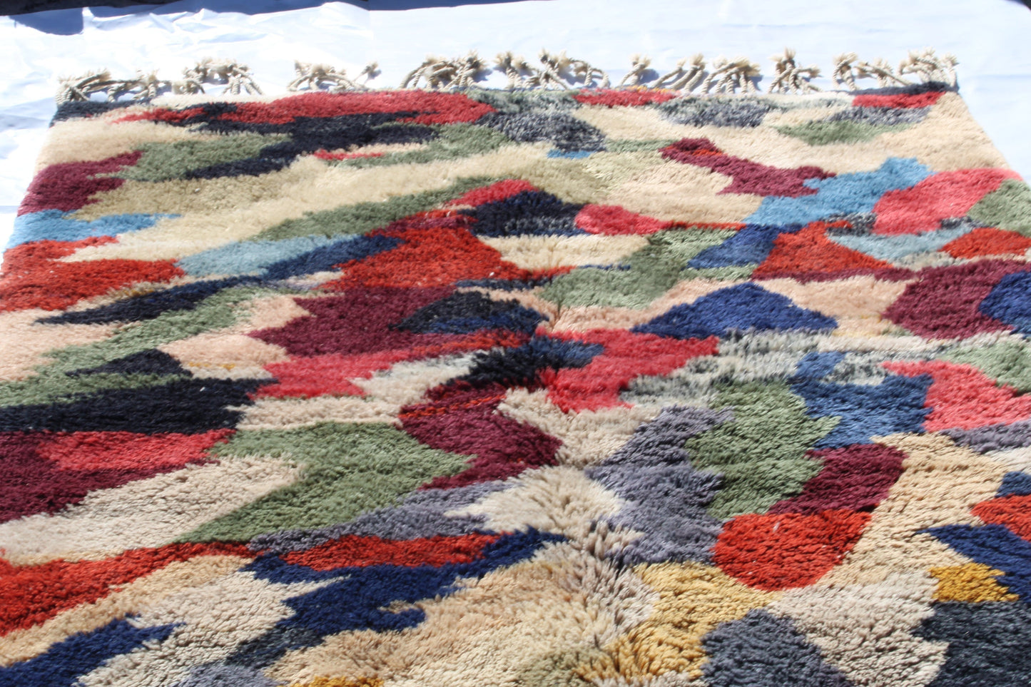 Beni Ourain rugs originate from the Atlas Mountains of Morocco and are characterized by their distinctive, neutral-toned, and geometric designs. These handwoven rugs often feature a plush pile and are made by the Berber tribes, size is 280x177 cm