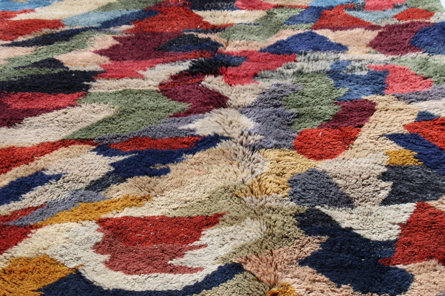 Beni Ourain rugs originate from the Atlas Mountains of Morocco and are characterized by their distinctive, neutral-toned, and geometric designs. These handwoven rugs often feature a plush pile and are made by the Berber tribes, size is 280x177 cm