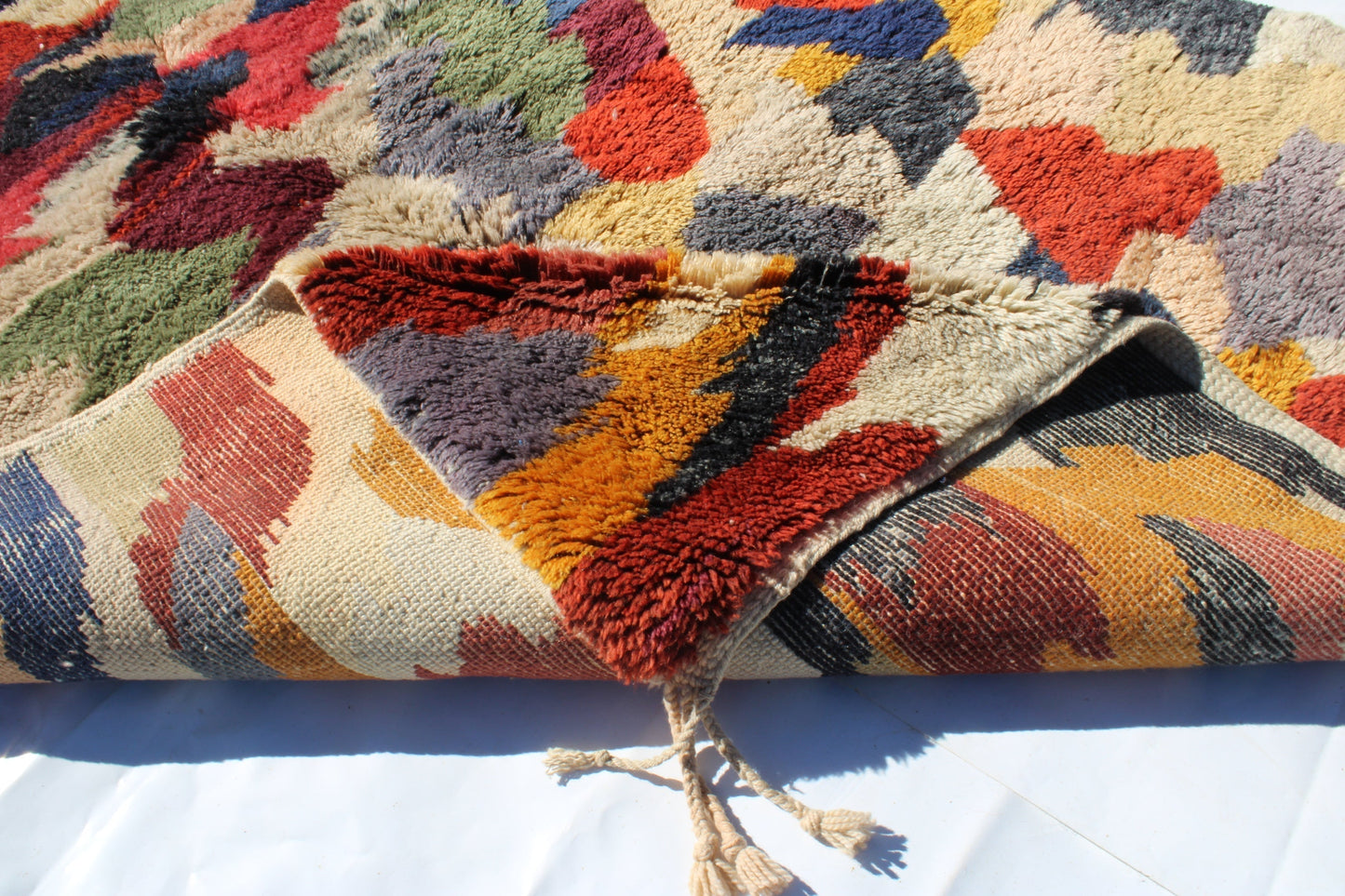 Beni Ourain rugs originate from the Atlas Mountains of Morocco and are characterized by their distinctive, neutral-toned, and geometric designs. These handwoven rugs often feature a plush pile and are made by the Berber tribes, size is 280x177 cm