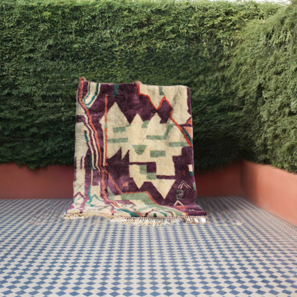 Beni Ourain rugs originate from the Atlas Mountains of Morocco and are characterized by their distinctive, neutral-toned, and geometric designs. These handwoven rugs often feature a plush pile and are made by the Berber tribes, size is 224x160 cm