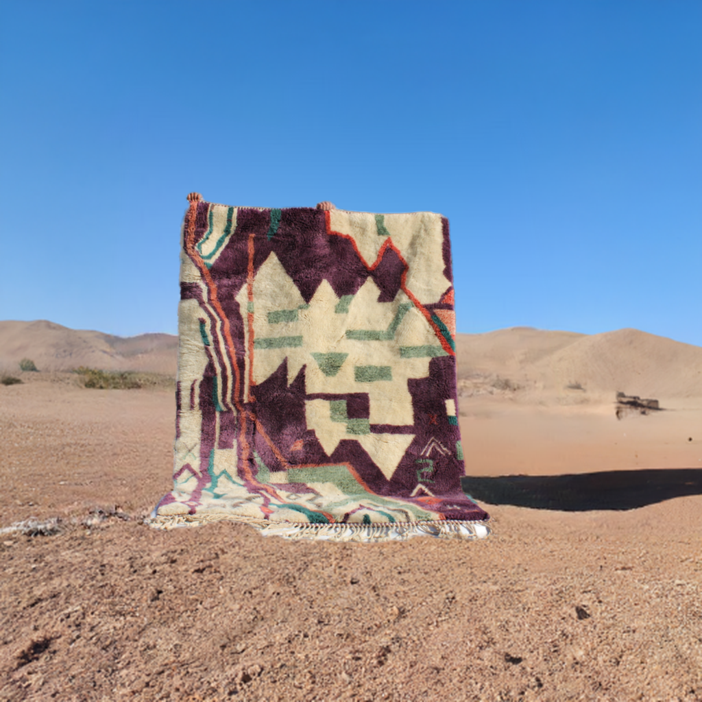 Beni Ourain rugs originate from the Atlas Mountains of Morocco and are characterized by their distinctive, neutral-toned, and geometric designs. These handwoven rugs often feature a plush pile and are made by the Berber tribes, size is 224x160 cm