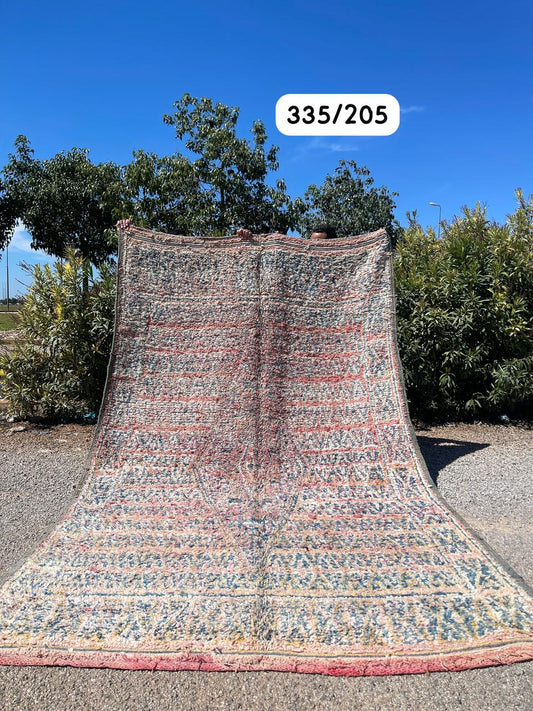 Transform your space with the exquisite charm of our Fabulous Boujad Rug, a true work of art crafted by skilled artisans in the heart of Morocco. This authentic Moroccan rug showcases the rich heritage and vibrant culture of the Boujad region