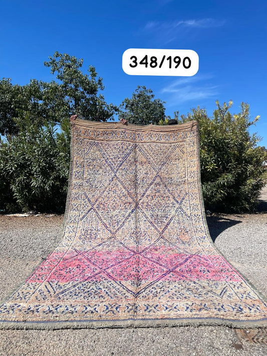 Transform your space with the exquisite charm of our Fabulous Boujad Rug, a true work of art crafted by skilled artisans in the heart of Morocco. This authentic Moroccan rug showcases the rich heritage and vibrant culture of the Boujad region