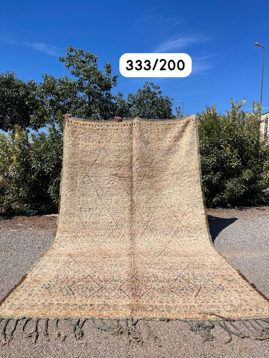 Transform your space with the exquisite charm of our Fabulous Boujad Rug, a true work of art crafted by skilled artisans in the heart of Morocco. This authentic Moroccan rug showcases the rich heritage and vibrant culture of the Boujad region