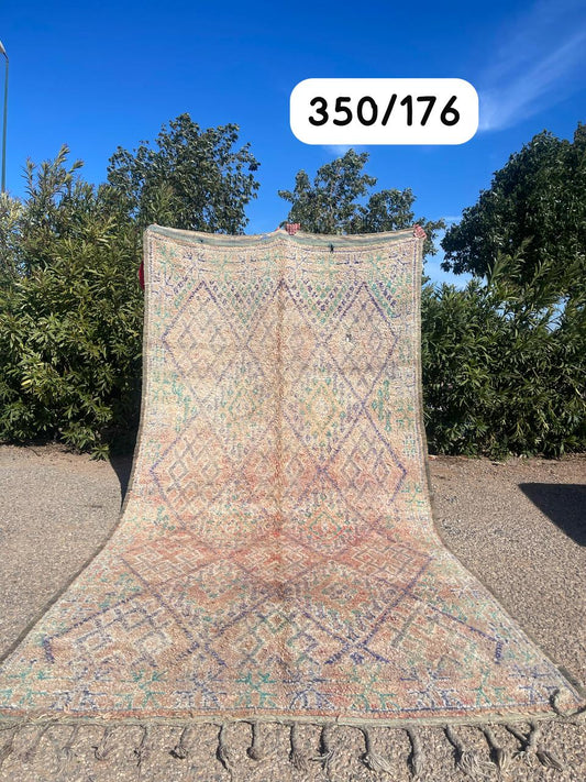 Transform your space with the exquisite charm of our Fabulous Boujad Rug, a true work of art crafted by skilled artisans in the heart of Morocco. This authentic Moroccan rug showcases the rich heritage and vibrant culture of the Boujad region