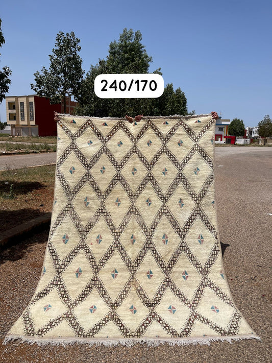 Transform your space with the exquisite charm of our Fabulous Boujad Rug, a true work of art crafted by skilled artisans in the heart of Morocco. This authentic Moroccan rug showcases the rich heritage and vibrant culture of the Boujad region