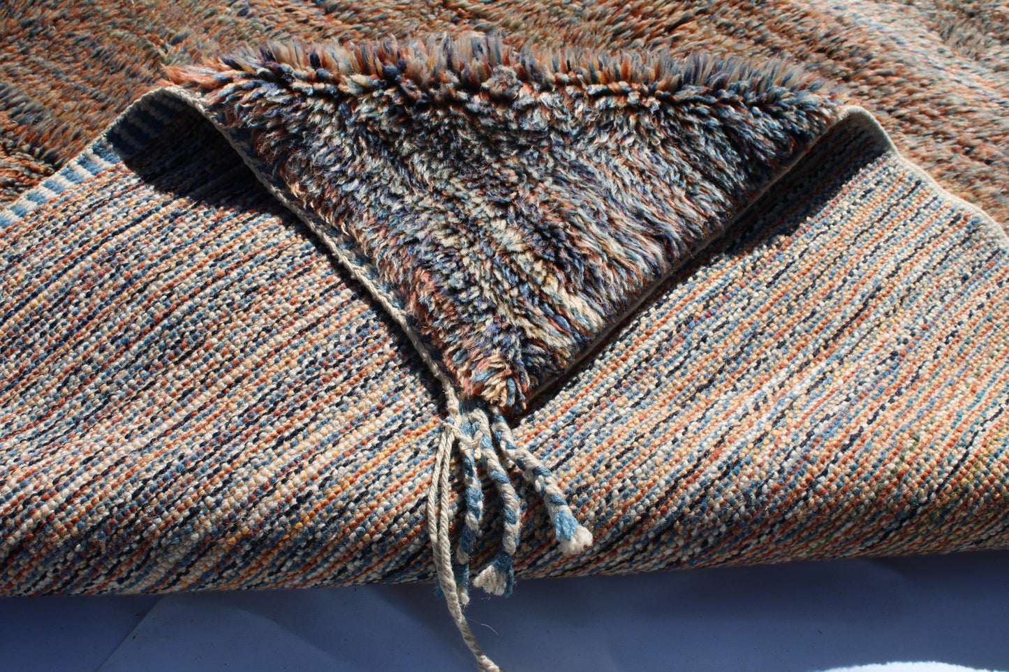 Beni Ourain rugs originate from the Atlas Mountains of Morocco and are characterized by their distinctive, neutral-toned, and geometric designs. These handwoven rugs often feature a plush pile and are made by the Berber tribes,  size is 250x155 cm