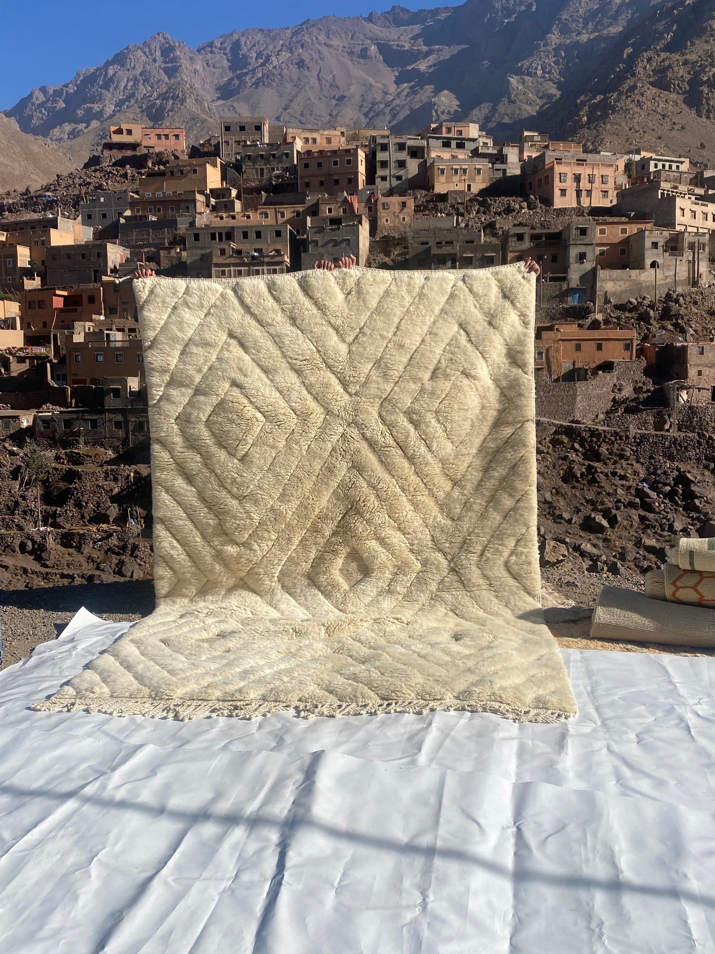 Beni Ourain rugs originate from the Atlas Mountains of Morocco and are characterized by their distinctive, neutral-toned, and geometric designs. These handwoven rugs often feature a plush pile and are made by the Berber tribes,  size is 300x200 cm