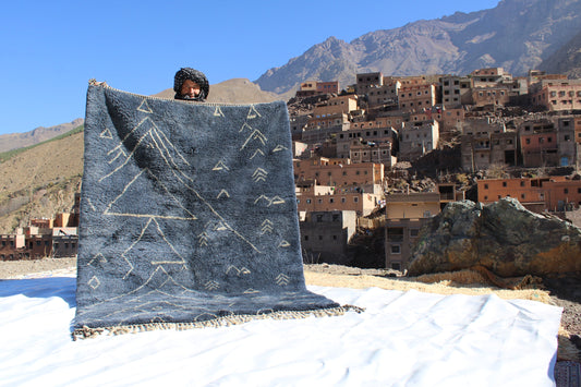Beni Ourain rugs originate from the Atlas Mountains of Morocco and are characterized by their distinctive, neutral-toned, and geometric designs. These handwoven rugs often feature a plush pile and are made by the Berber tribes,  size is 210x160 cm