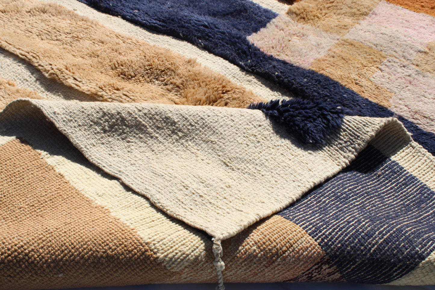 Beni Ourain rugs originate from the Atlas Mountains of Morocco and are characterized by their distinctive, neutral-toned, and geometric designs. These handwoven rugs often feature a plush pile and are made by the Berber tribes,  size is 260x165 cm