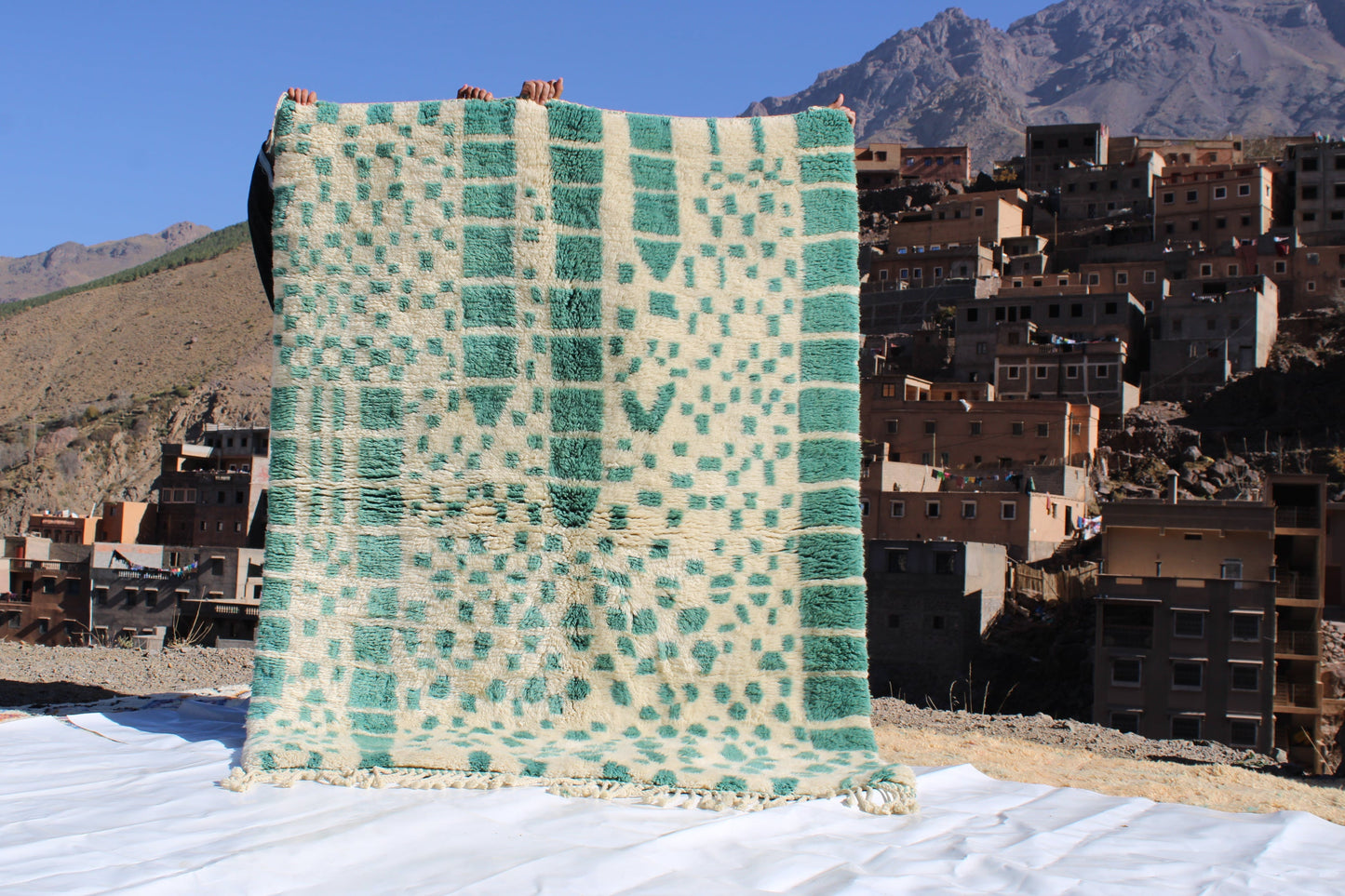 Beni Ourain rugs originate from the Atlas Mountains of Morocco and are characterized by their distinctive, neutral-toned, and geometric designs. These handwoven rugs often feature a plush pile and are made by the Berber tribes,  size is 215x160 cm