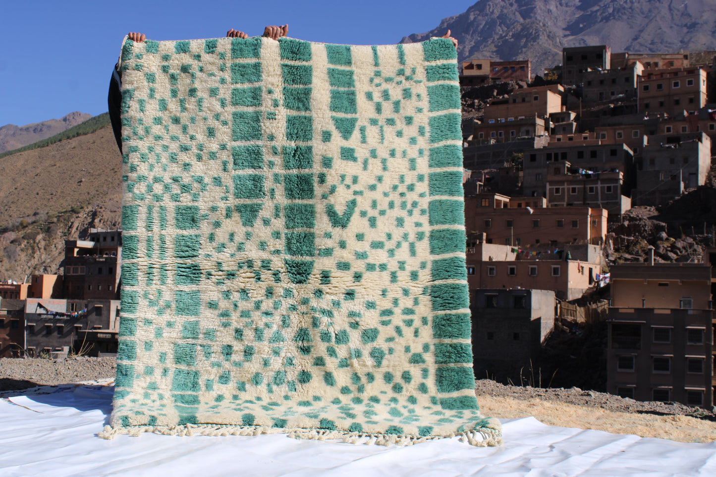 Beni Ourain rugs originate from the Atlas Mountains of Morocco and are characterized by their distinctive, neutral-toned, and geometric designs. These handwoven rugs often feature a plush pile and are made by the Berber tribes,  size is 215x160 cm