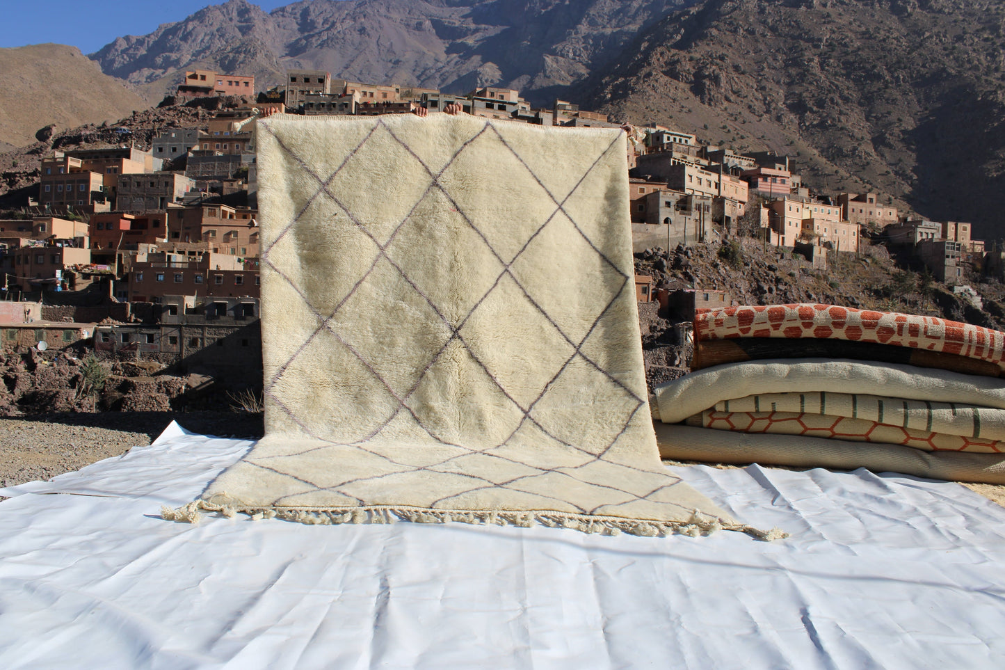 Beni Ourain rugs originate from the Atlas Mountains of Morocco and are characterized by their distinctive, neutral-toned, and geometric designs. These handwoven rugs often feature a plush pile and are made by the Berber tribes,  size is 310x200 cm