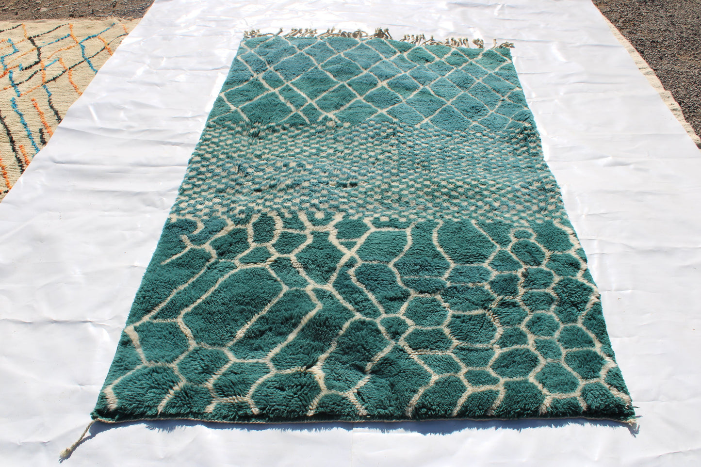 Beni Ourain rugs originate from the Atlas Mountains of Morocco and are characterized by their distinctive, neutral-toned, and geometric designs. These handwoven rugs often feature a plush pile and are made by the Berber tribes,  size is 260x192 cm