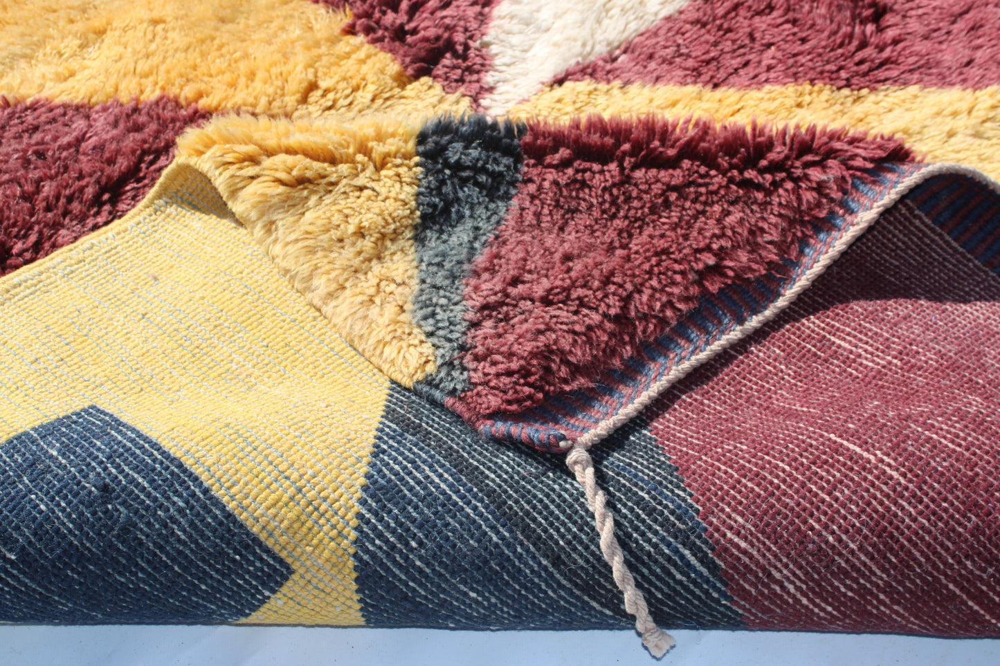 Beni Ourain rugs originate from the Atlas Mountains of Morocco and are characterized by their distinctive, neutral-toned, and geometric designs. These handwoven rugs often feature a plush pile and are made by the Berber tribes,  size is 300x180 cm