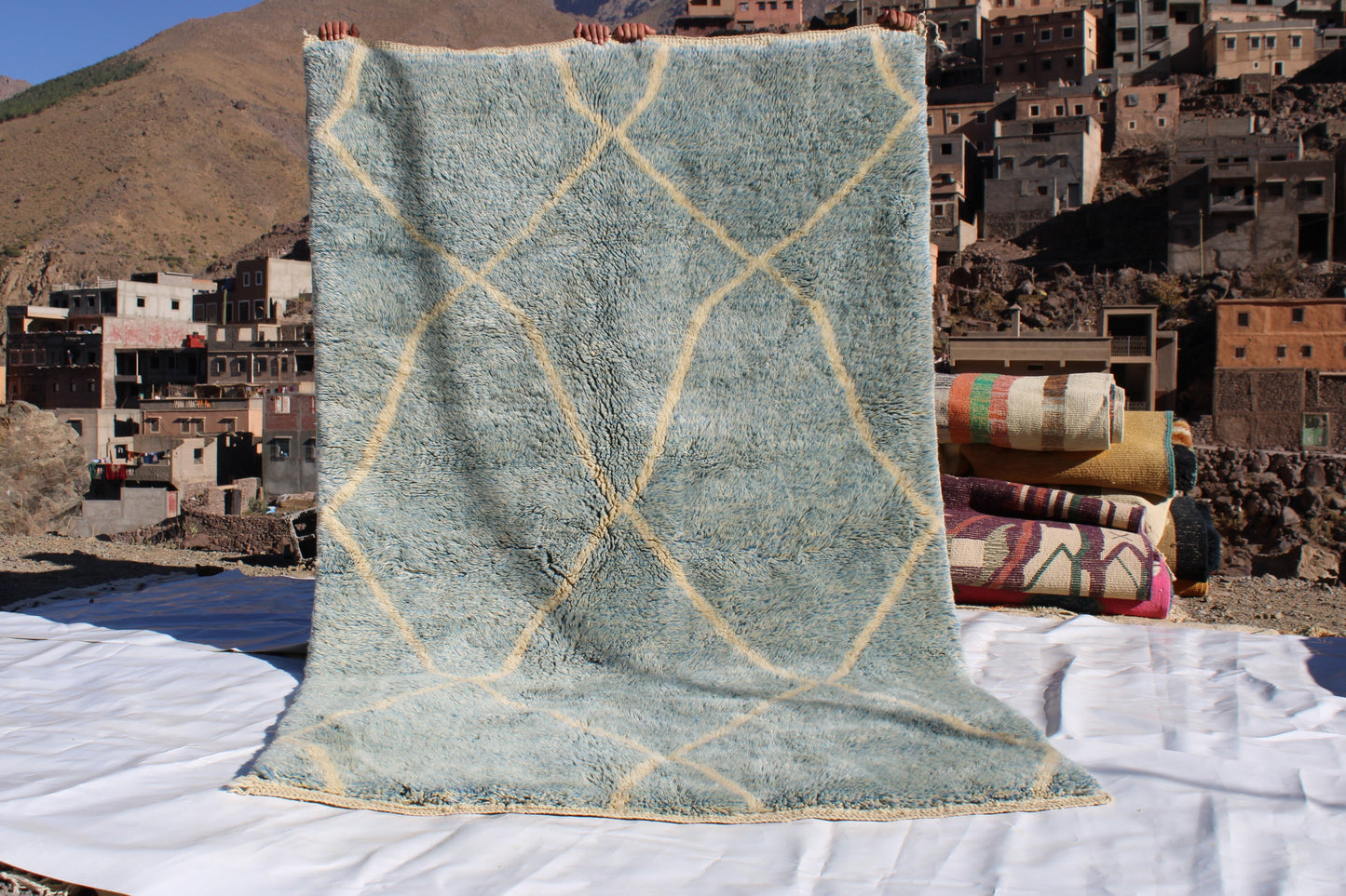Beni Ourain rugs originate from the Atlas Mountains of Morocco and are characterized by their distinctive, neutral-toned, and geometric designs. These handwoven rugs often feature a plush pile and are made by the Berber tribes,  size is 260x160 cm