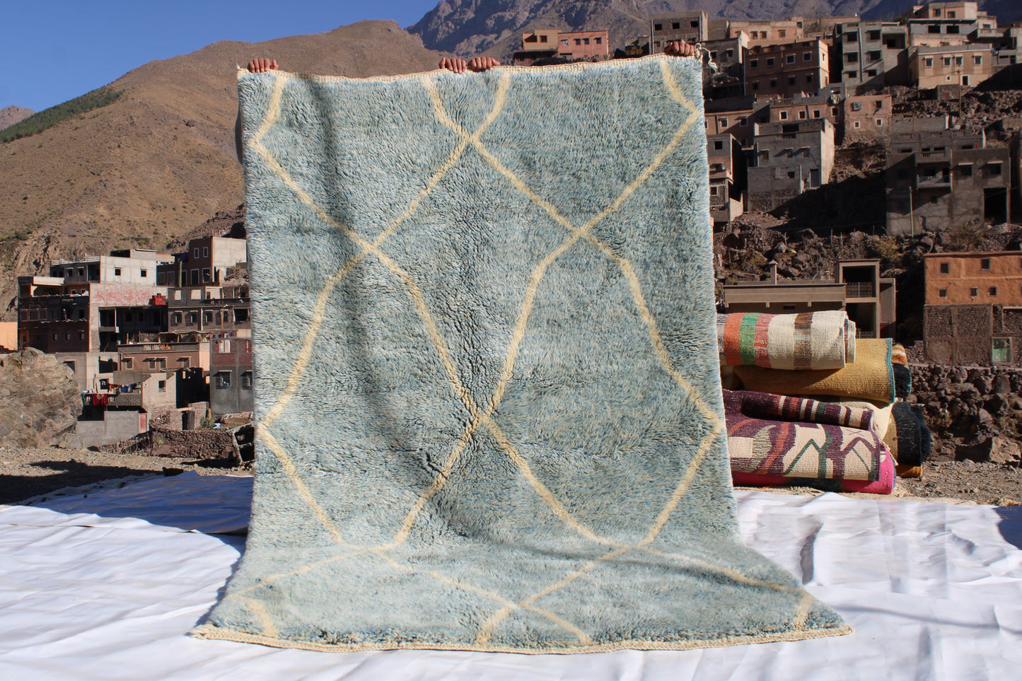 Beni Ourain rugs originate from the Atlas Mountains of Morocco and are characterized by their distinctive, neutral-toned, and geometric designs. These handwoven rugs often feature a plush pile and are made by the Berber tribes,  size is 260x160 cm