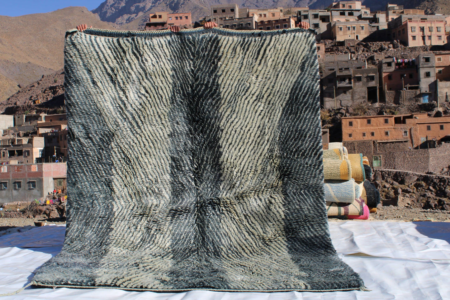 Beni Ourain rugs originate from the Atlas Mountains of Morocco and are characterized by their distinctive, neutral-toned, and geometric designs. These handwoven rugs often feature a plush pile and are made by the Berber tribes,  size is 254x190 cm